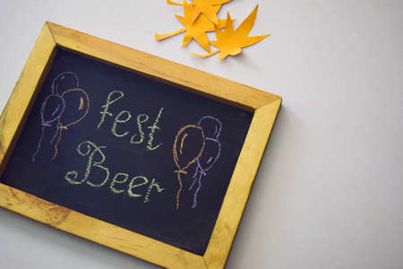 Celebrate october festival - clothes pins on grey/white background and a chalkboard with the slogan "Fest Beer"の写真素材