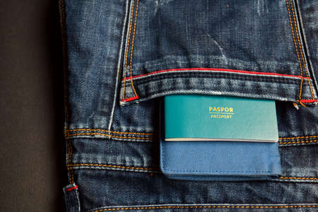 Closeup Passport, wallet, Jeans and Preparing for travelingの写真素材