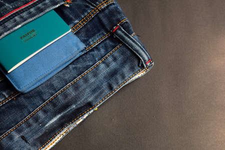 Closeup Passport, wallet, Jeans and Preparing for travelingの写真素材