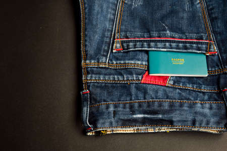 Closeup Passport, wallet, Jeans and Preparing for travelingの写真素材