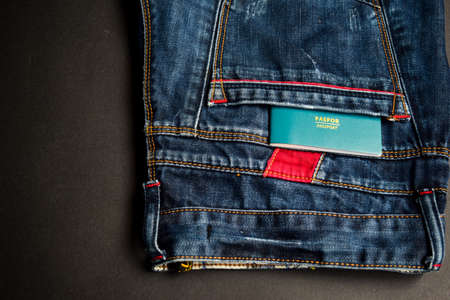 Closeup Passport, wallet, Jeans and Preparing for traveling