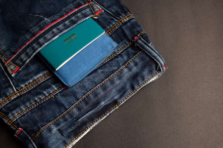 Closeup Passport, wallet, Jeans and Preparing for travelingの写真素材