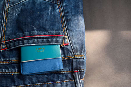 Closeup Passport, wallet, Jeans and Preparing for travelingの写真素材