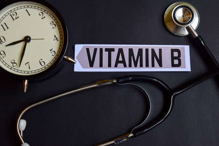 Vitamin B on the paper with Healthcare Concept Inspiration. alarm clock, Black stethoscope.の写真素材