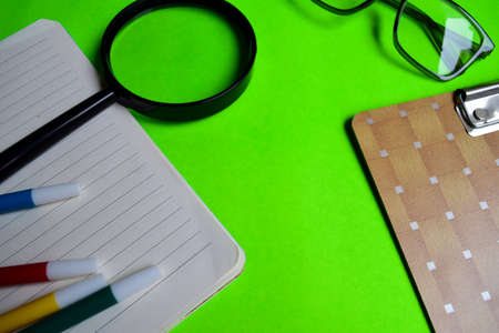 opened book in green background with motivation and education conceptsの写真素材