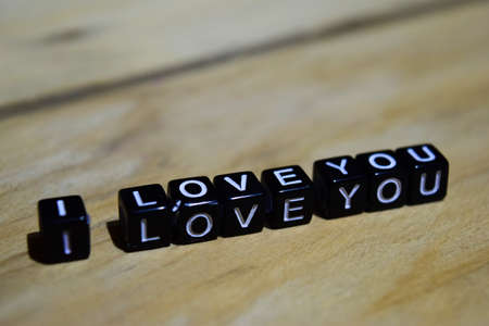 I love you written on wooden blocks. Inspiration and motivation concepts. Cross processed image on...