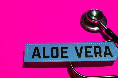Aloe Vera on the print paper with medicare Concept Inspiration. Stethoscope on pink bakcgroundの写真素材