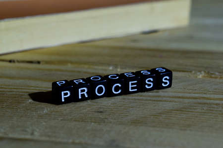 Process on wooden blocks. Motivation and inspiration concept. Cross processed imageの写真素材