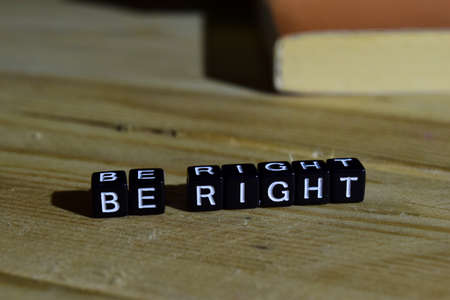 Be right on wooden blocks. Motivation and inspiration concept. Cross processed imageの写真素材