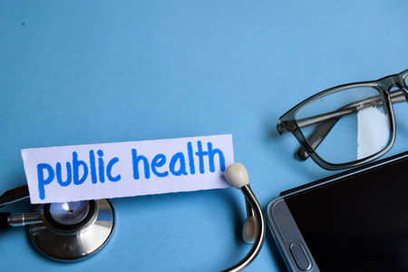 Conceptual image with Public health inscription with the view of stethoscope, eyeglasses and...