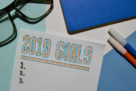 Top view 2019 GOALS text list with marker and eyeglasses for business presentation mock up for adding your listの写真素材