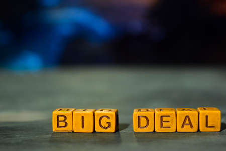 Big deal on wooden blocks. Cross processed image with bokeh backgroundの写真素材