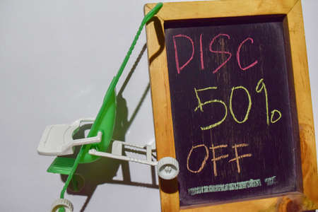 Message Disc 50% OFF on Chalkboard and Green Baby Stroller or trolley cart on white background....