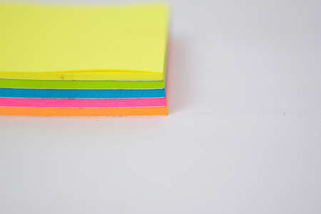 Close up colorful sticky notes isolated on white background.