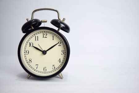 Clock ticking to 10 o'clock isolated on white backgroundの写真素材