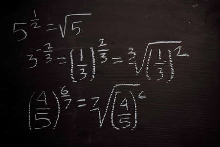 Close up math formulas written on a blackboard. Education conceptの写真素材