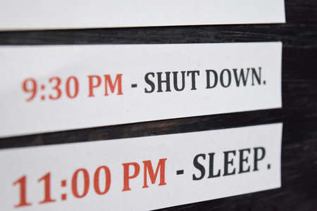 Close up making agenda Daily schedule on personal organizer. Business and entrepreneur concept. Isolated on a black backgroundの写真素材