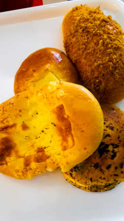 Breads and baked goods large assortment in bakery shelves with fresh baked crispy bread organic
