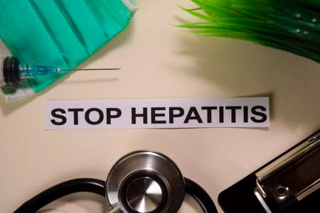 STOP HEPATITIS with inspiration and healthcare/medical concept on desk backgroundの写真素材