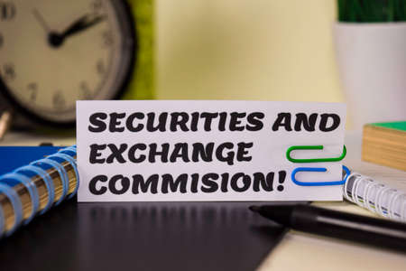 Securities and Exchange Commision! on the paper isolated on it desk. Business and inspiration...