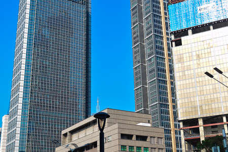 JAKARTA, INDONESIA, JUNE 8, 2019 : modern glass and steel office buildings low angle skyscraper view...