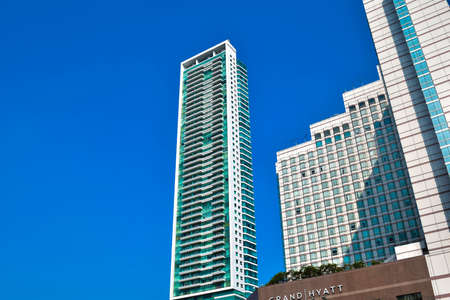 JAKARTA, INDONESIA, JUNE 8, 2019 : modern glass and steel office buildings low angle skyscraper view...
