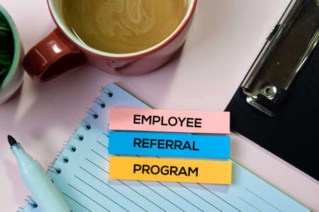 Employee Referral Program text on sticky notes with office desk conceptの写真素材