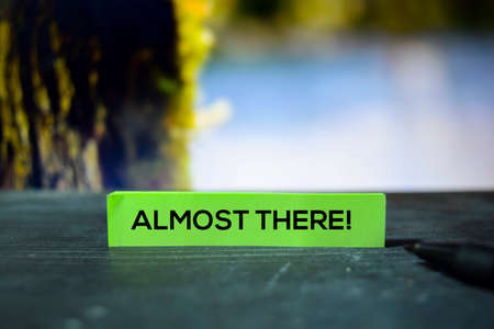 Almost There! on the sticky notes with bokeh backgroundの写真素材