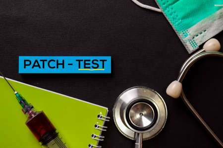 Patch - Test on top view black table with blood sample and Healthcare/medical concept.