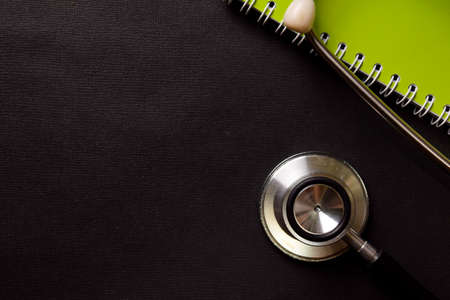 Stethoscope isolated on black background. Healthcare/Medical conceptの写真素材