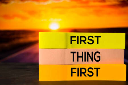 First Thing First on the sticky notes with bokeh backgroundの写真素材