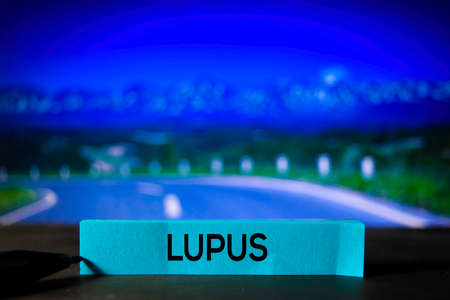 Lupus on the sticky notes with bokeh backgroundの写真素材