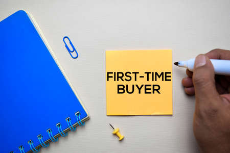 First Time Buyer text on sticky notes with office desk conceptの写真素材