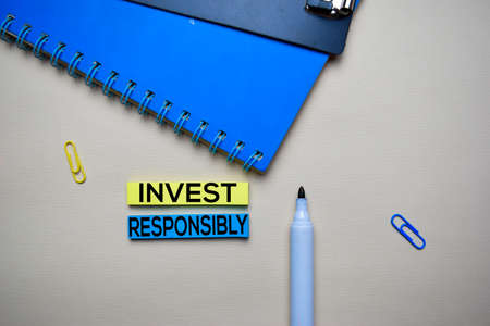 Invest Responsibly text on sticky notes with office desk. Stock Market Exchange Conceptの写真素材