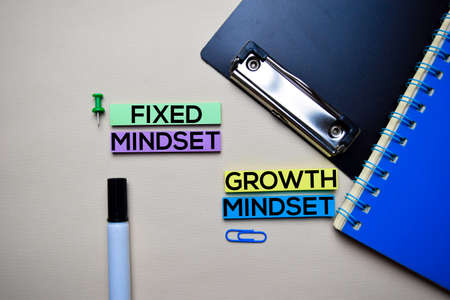 Fixed Mindset or Growth Mindset text on sticky notes with office desk conceptの写真素材