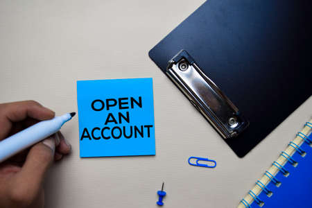 Open an Account text on sticky notes with office desk. Stock Market Exchange Conceptの写真素材
