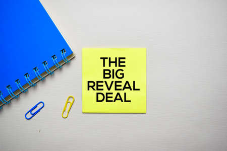 The Big Reveal Deal text on sticky notes with office desk conceptの写真素材