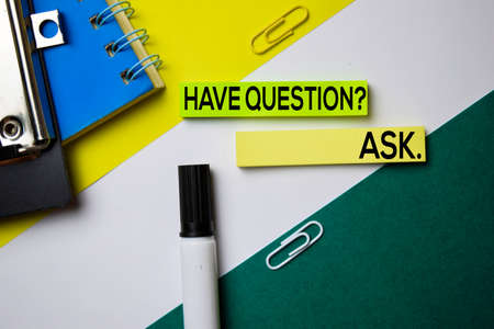 Have Question? ASK. text on sticky notes with office desk conceptの写真素材