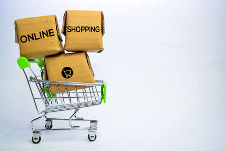 Online Shopping Text in small boxes and shopping cart. Concepts about online shopping. Isolated on...