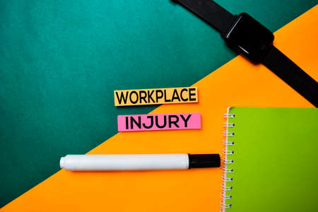Workplace Injury text on top view color table background.の写真素材