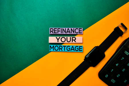 Refinance Your Mortgage text on top view color table background.の写真素材