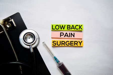 Low Back Pain Surgery text on top view isolated on white background. Healthcare/Medical concept