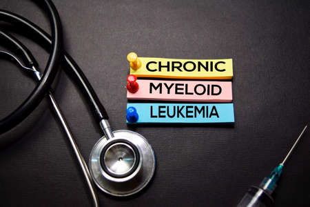 Chronic Myeloid Leukemia text on Sticky Notes. Top view isolated on black background. Healthcare/Medical conceptの写真素材