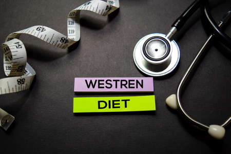 Westren Diet text on Sticky Notes. Top view isolated on black background. Healthcare/Medical concept
