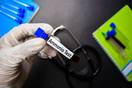 Ammonia Test text with blood sample. Top view isolated on black background. Healthcare/Medical conceptの写真素材