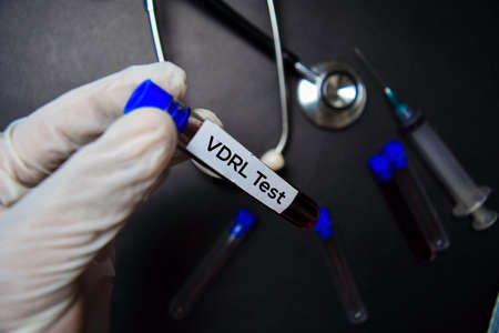 VDRL Test text with blood sample. Top view isolated on black background. Healthcare/Medical conceptの写真素材