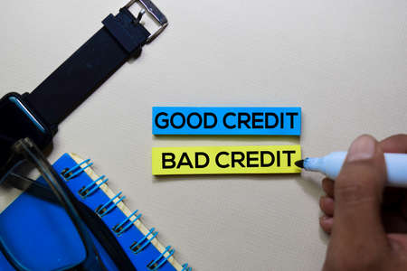 Good Credit or Bad Credit text on sticky notes isolated on office desk