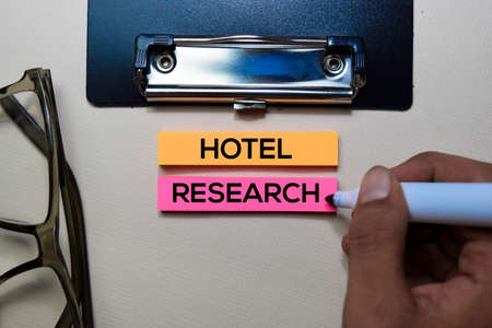 Hotel Research text on sticky notes isolated on office desk