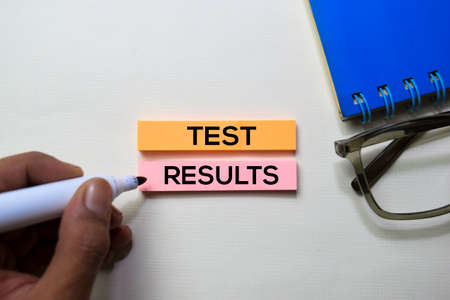 Test Results text on sticky notes isolated on office desk