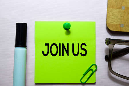 Join Us text on sticky notes isolated on office desk